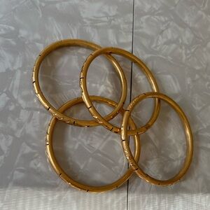 Set of four - brass / gold etched bangles